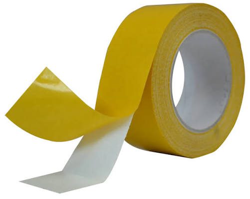 Yellow adhesive tape roll partially unspooled.