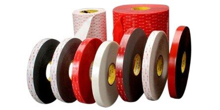 Colored adhesive tape rolls in various sizes.