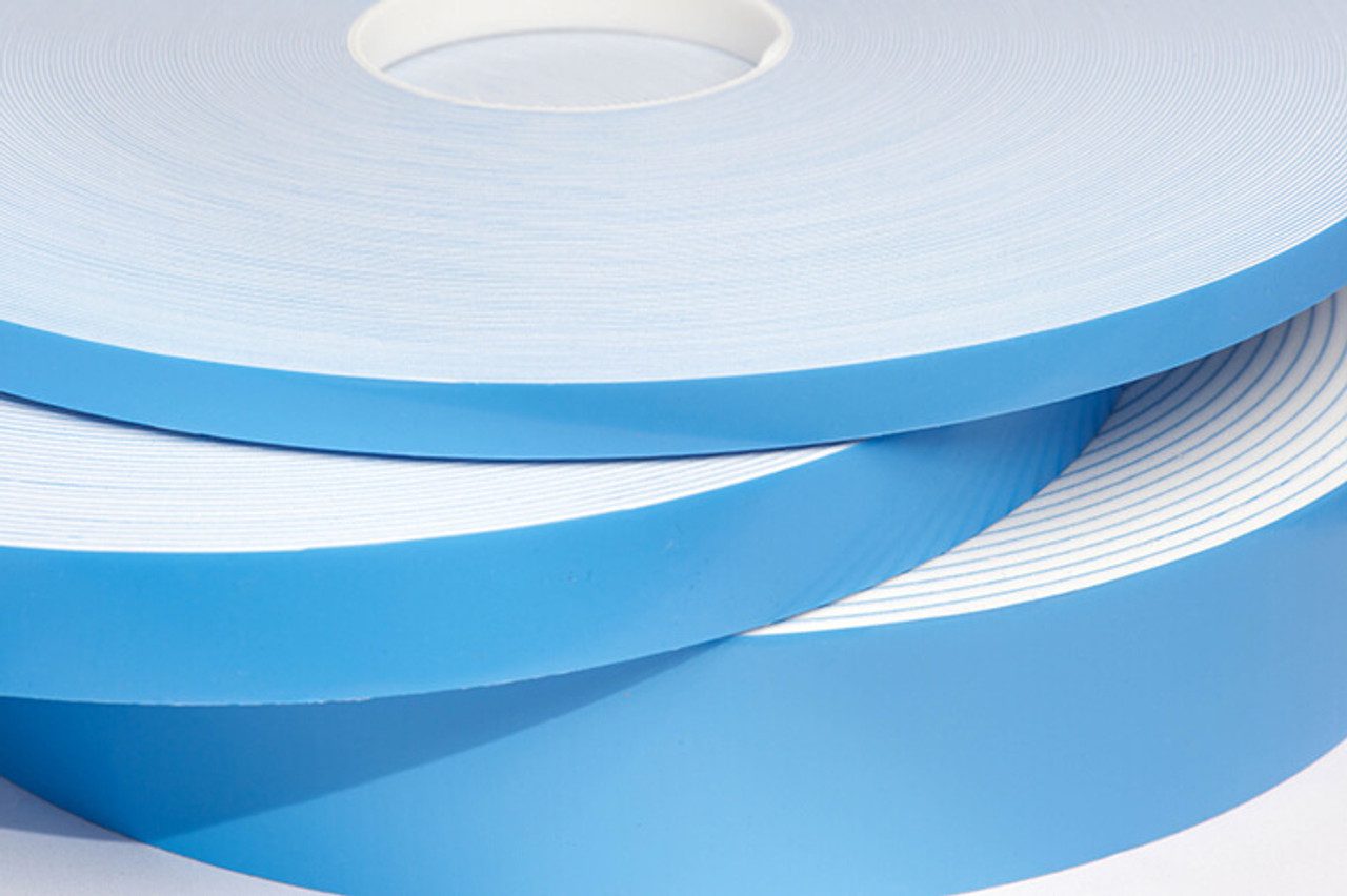 Blue adhesive tape rolls stacked together.