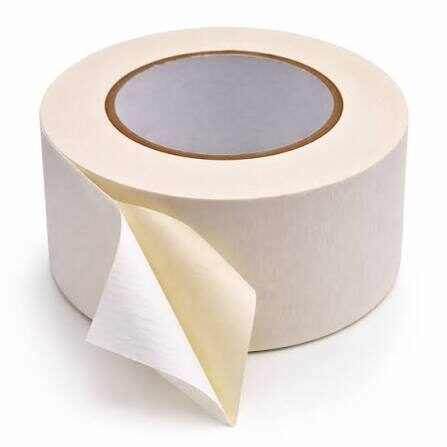 Roll of white adhesive tape, partially unrolled.