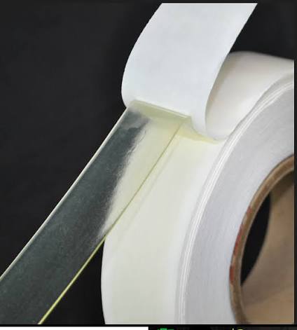 Double-sided adhesive tape on a roll.