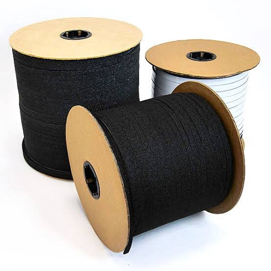 Black and white cable spools on display.