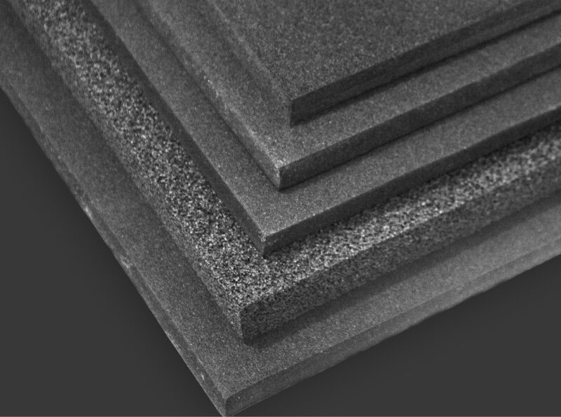 Stacked black foam sheets, varying textures.