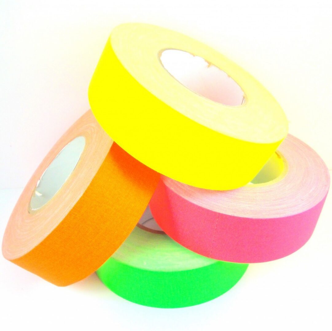 Colorful rolls of tape stacked together.