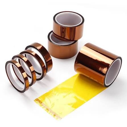 Copper tape rolls with yellow backing sheet.