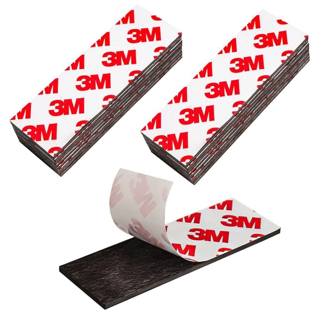 3M adhesive strips stacked and separated.