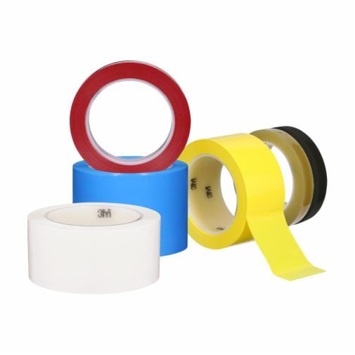 Colorful rolls of adhesive tape stacked together.