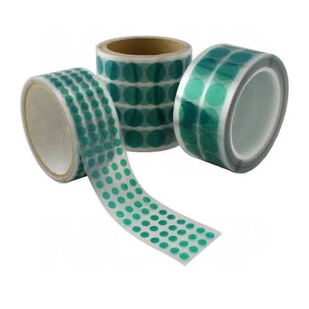 Rolls of adhesive tape with green dots.