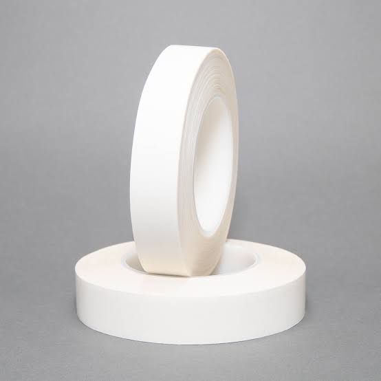 Two rolls of white adhesive tape.