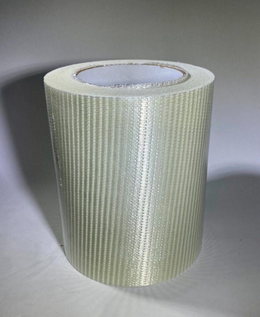 Roll of white adhesive mesh tape.