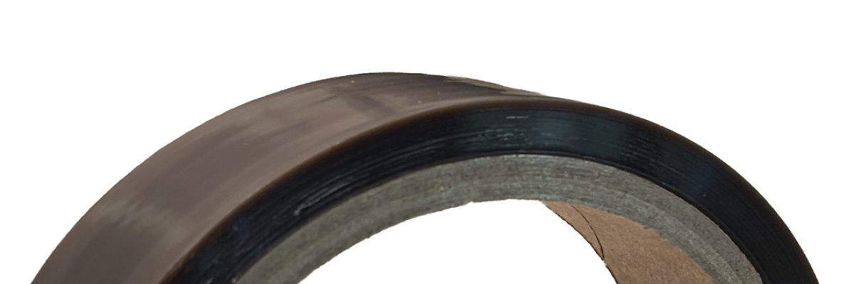 Black roll of adhesive tape.