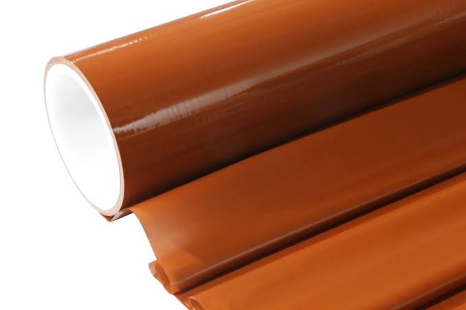 Roll of shiny brown adhesive tape.