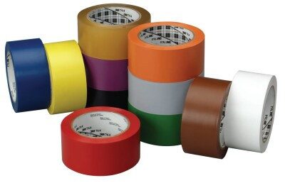 Colorful rolls of adhesive tape stacked together.