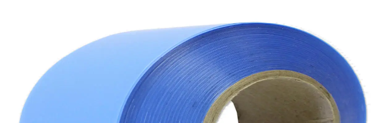 Roll of blue PVC tape on a white background