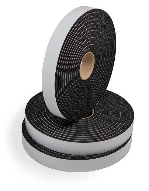 Roll of black and white double-sided foam tape on a white background